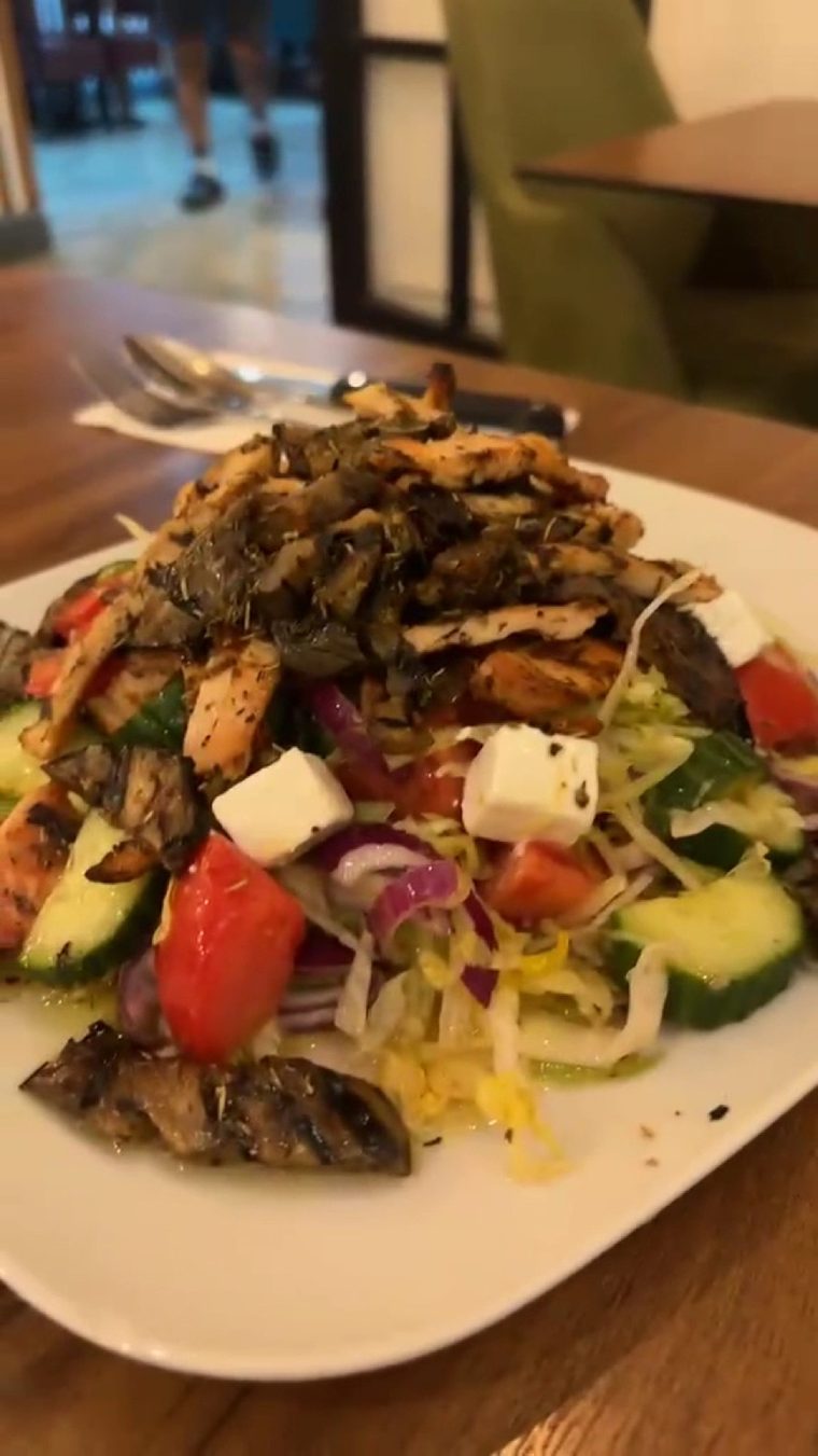 Stacked chicken and vegetable salad with feta